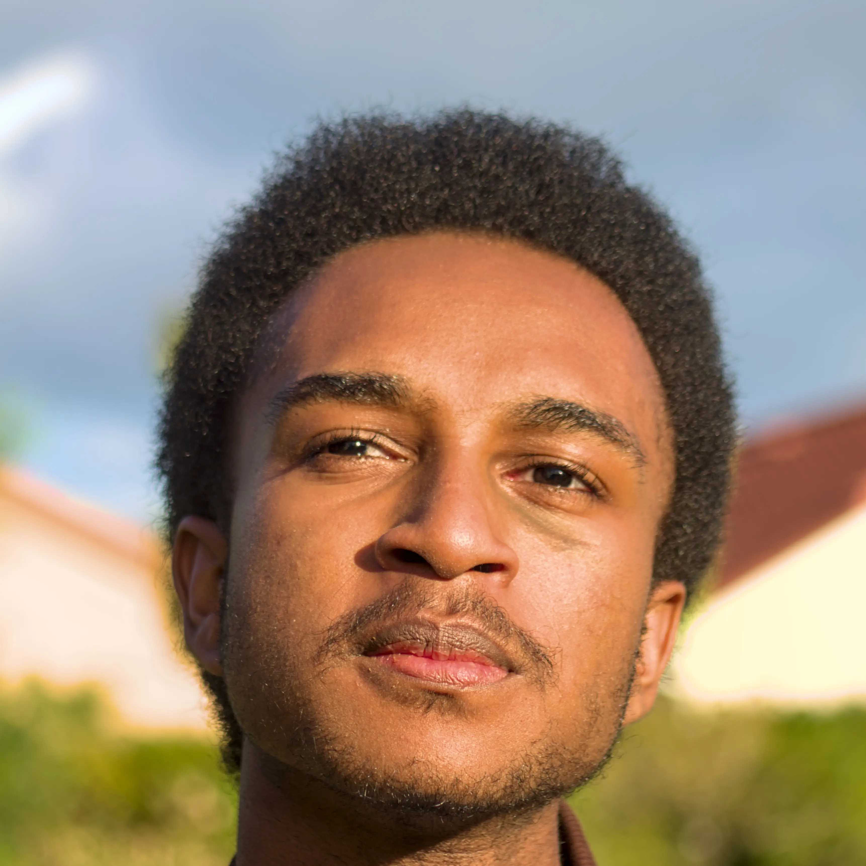 Professional headshot of Zaki